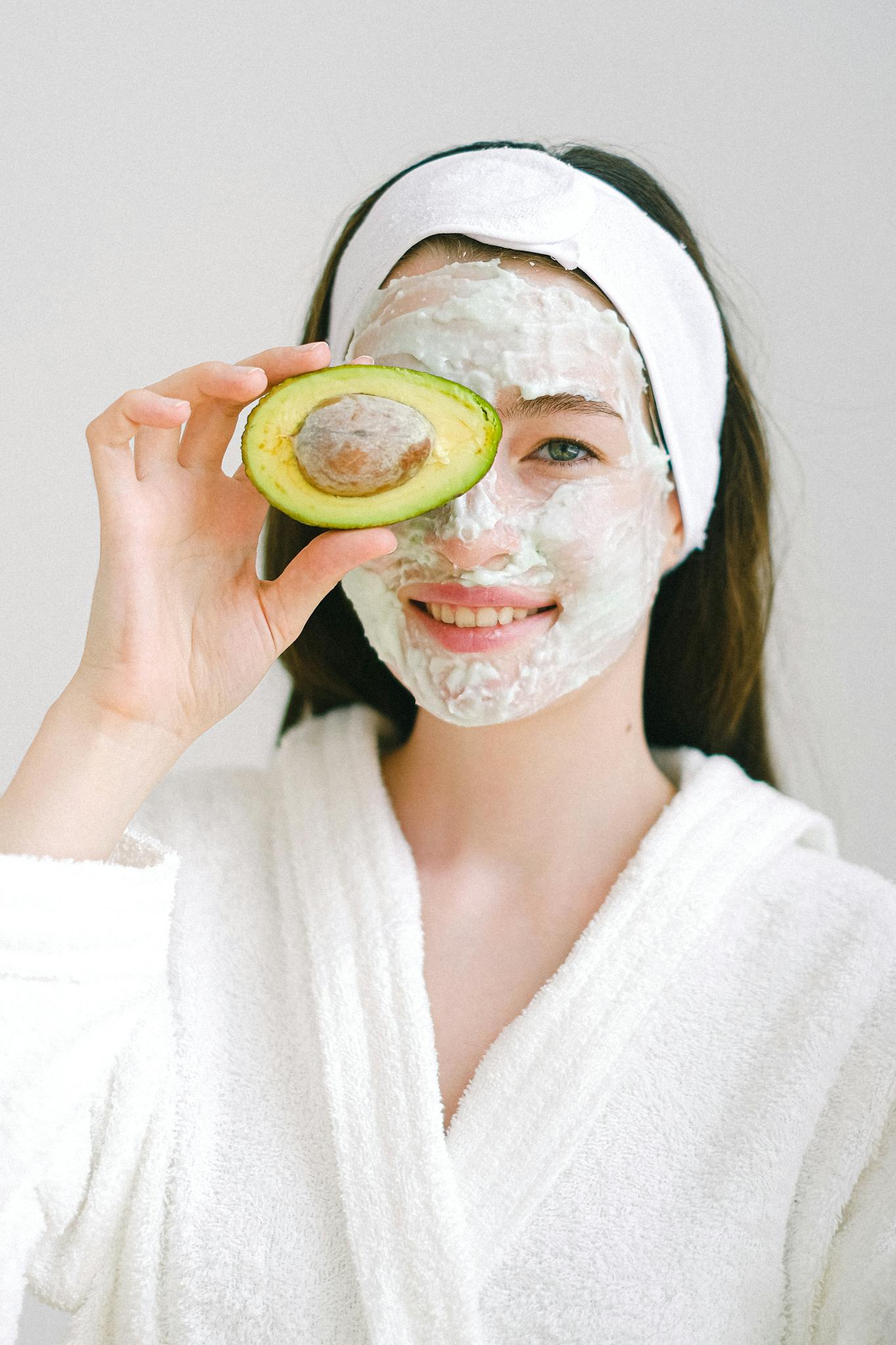 cheerful woman with mask and avocado 1