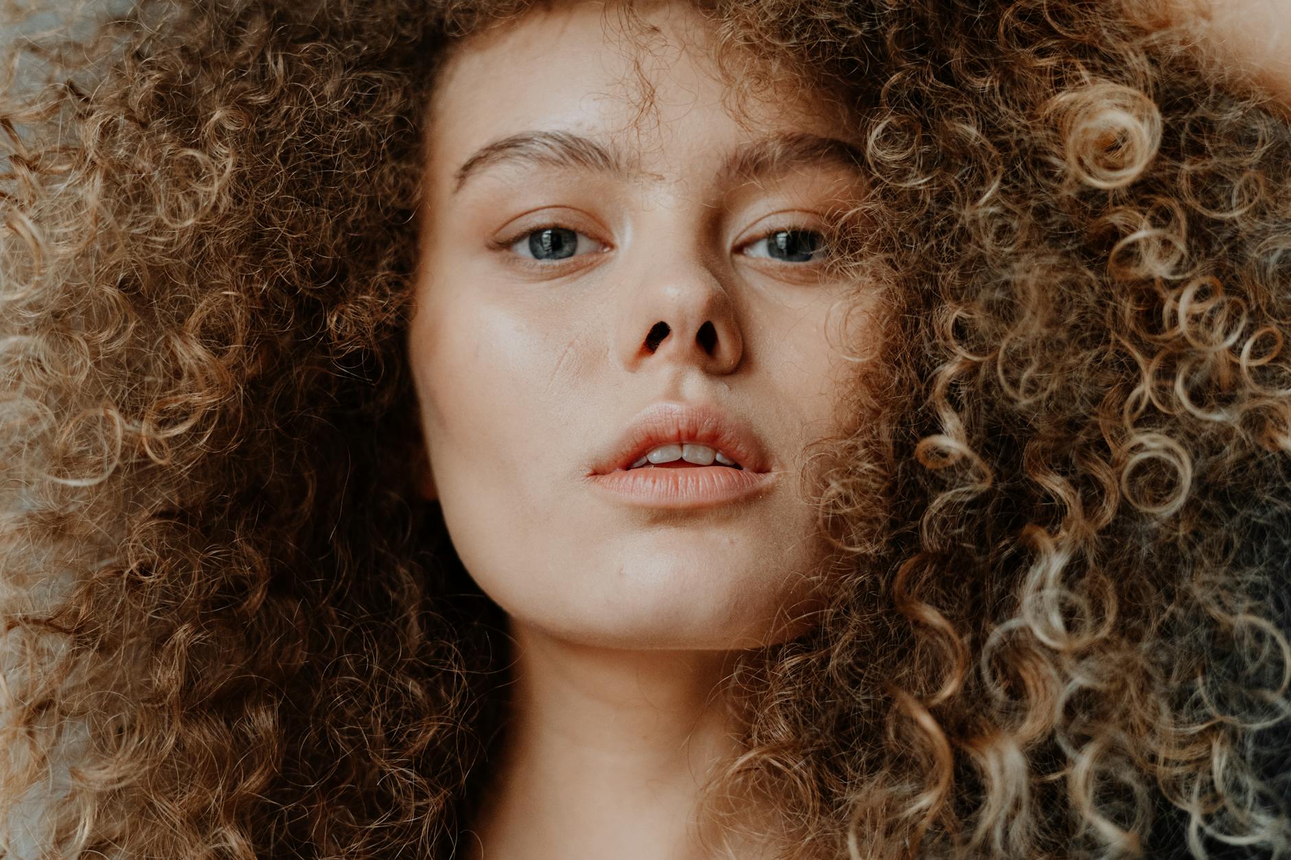 https://www.pexels.com/photo/girl-with-brown-curly-hair-4153800/